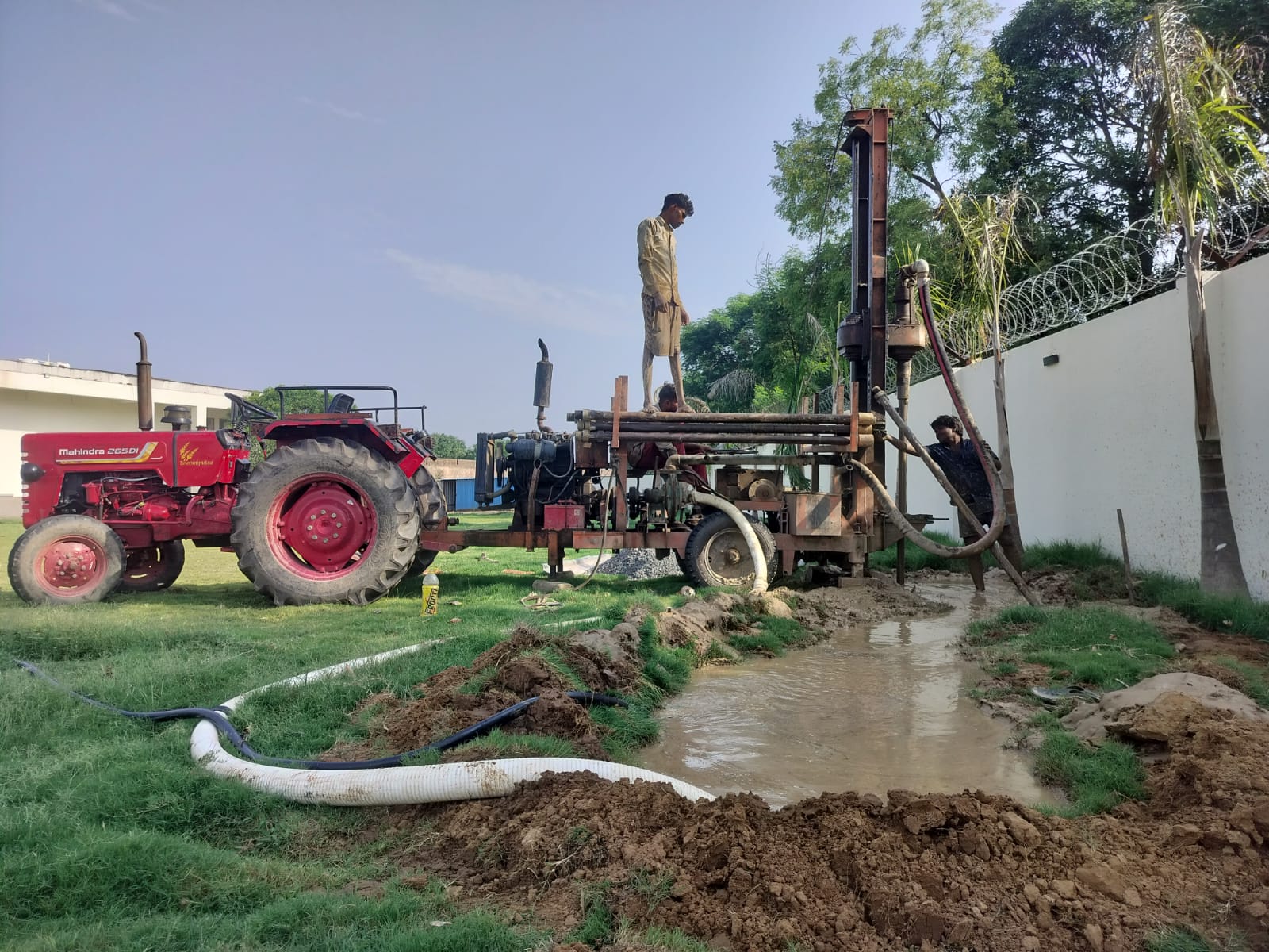 Drill rig boring a new borehole